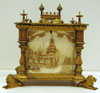 Brass box with lion feet and white decorated panels on sides